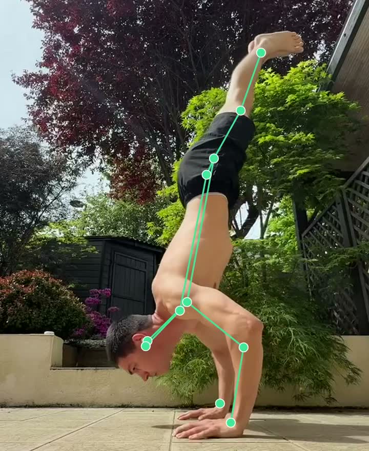 Freestanding handstand push-up near the bottom of the rep, filmed from the side